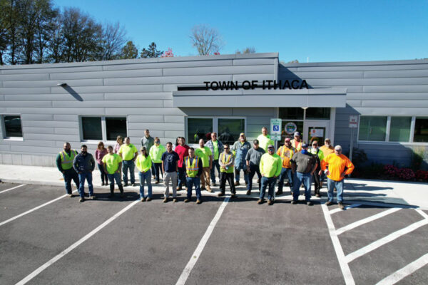public works staff in front of public works building